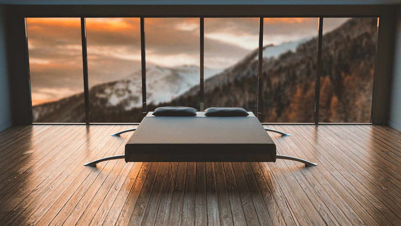 digital Minimalist bedroom with large windows offering a breathtaking mountain view during sunset.