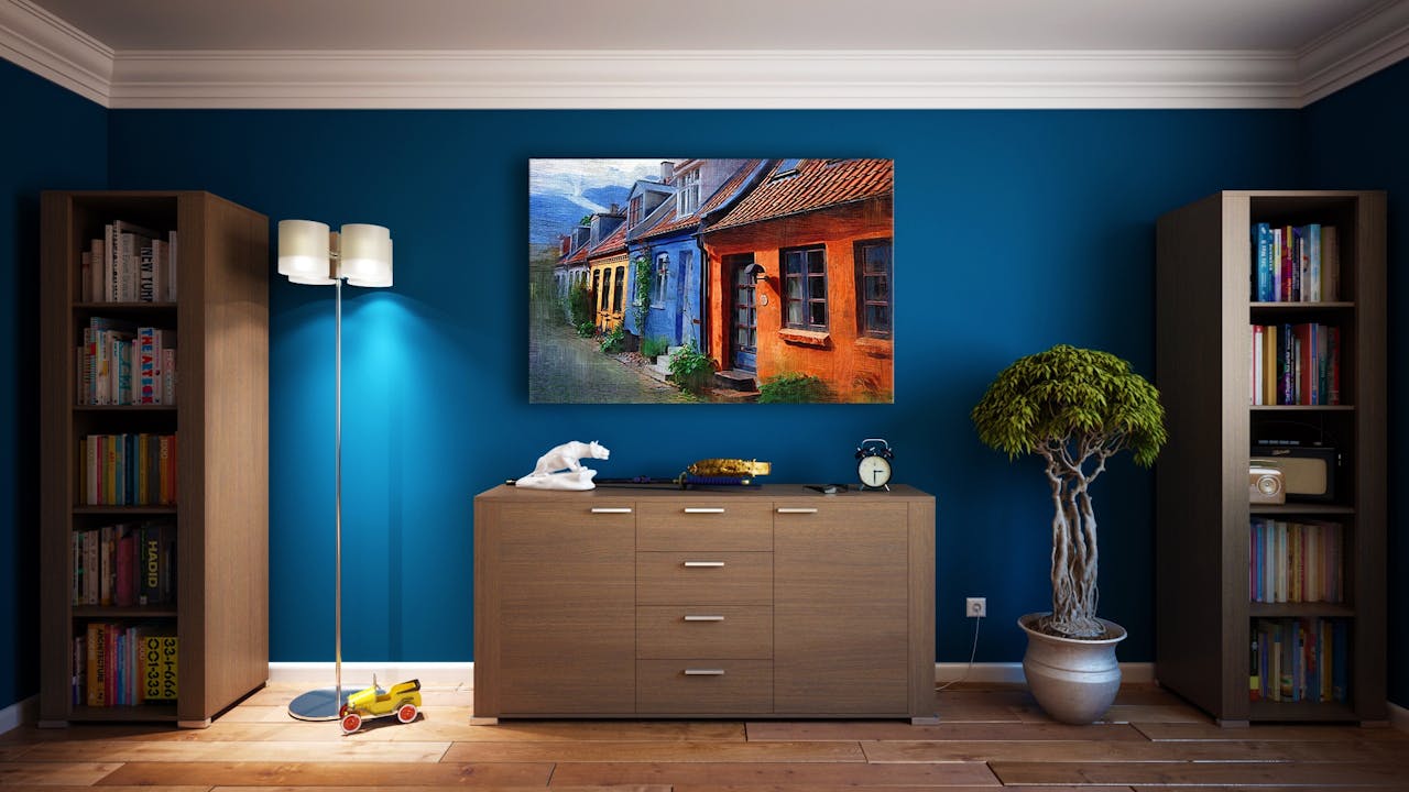 why-choose-us A modern living room featuring stylish bookshelves, a vibrant painting, and minimalistic decor.